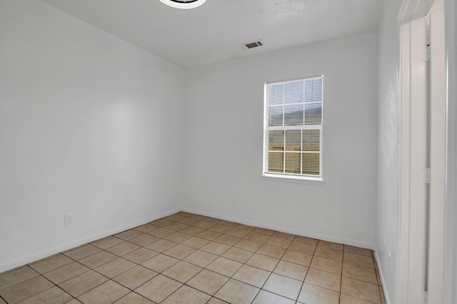 6933 Liverpool St, Houston, TX 77021 - empty room with light tile patterned floors and baseboards