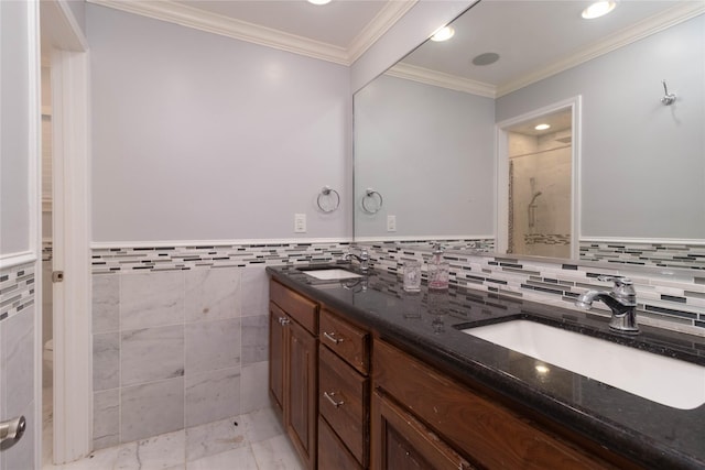 1918 Thousand Pines Dr, Houston, TX 77339 - full bathroom featuring double vanity, a shower stall, crown molding, tile walls, and a wainscoted wall