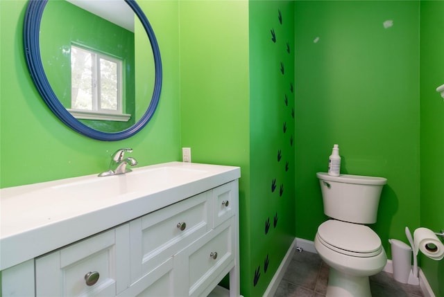 1918 Thousand Pines Dr, Houston, TX 77339 - half bath featuring vanity, toilet, tile patterned floors, and baseboards
