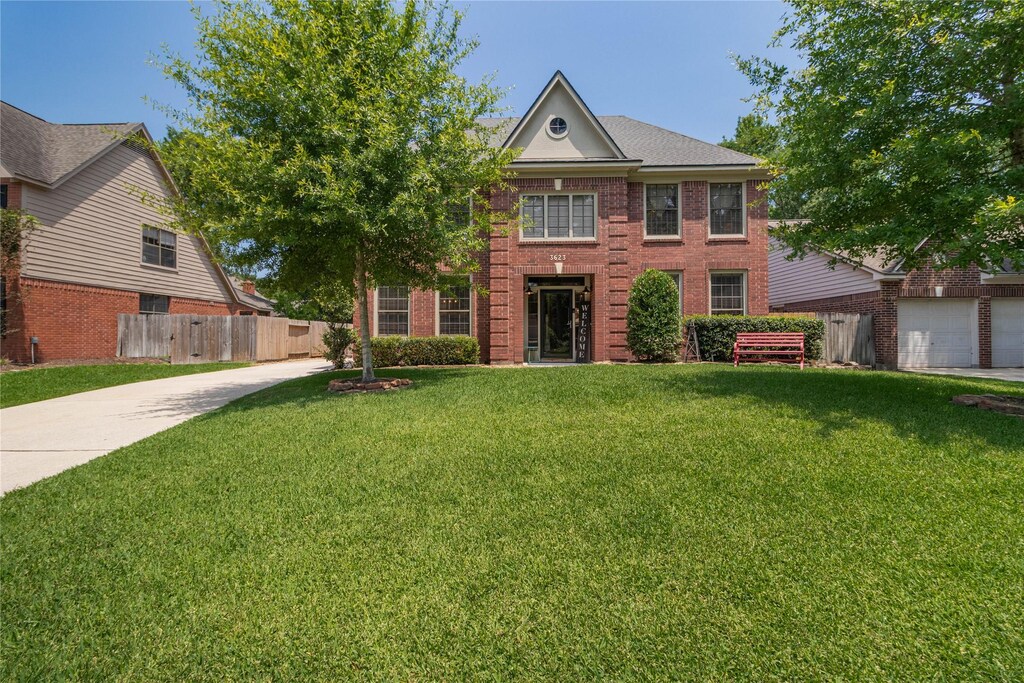 3623 Scenic Valley Dr, Houston, TX 77345 - colonial home featuring brick siding