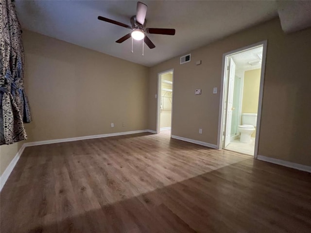 2300 Old Spanish Trl Unit 1111, Houston, TX 77054 - spare room with a ceiling fan, wood finished floors, and baseboards