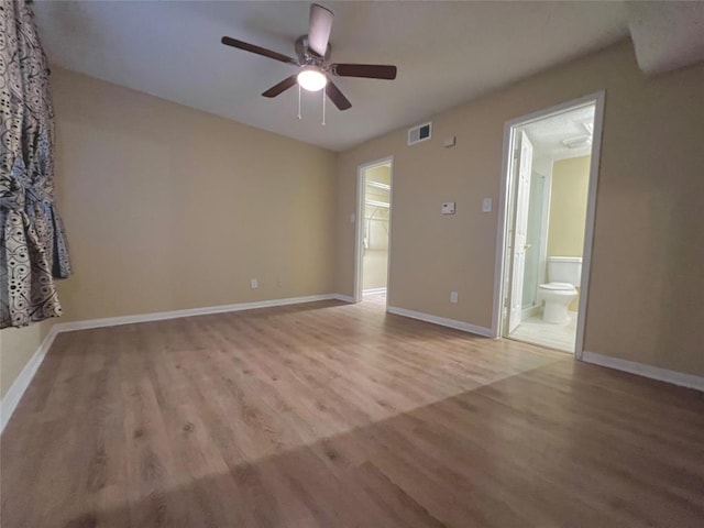2300 Old Spanish Trl Unit 1111, Houston, TX 77054 - unfurnished room featuring a ceiling fan, light wood-style floors, and baseboards