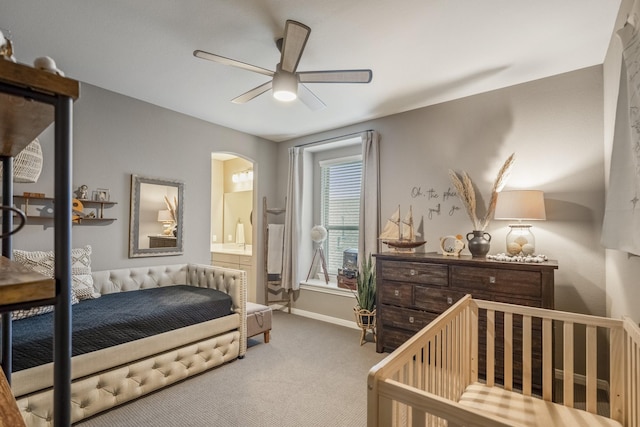 28203 Middlewater View Ln, Katy, TX 77494 - bedroom with carpet flooring, arched walkways, baseboards, connected bathroom, and ceiling fan