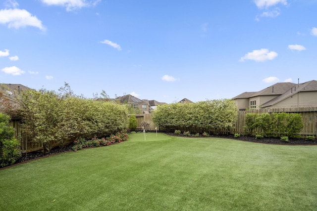 28203 Middlewater View Ln, Katy, TX 77494 - fenced backyard featuring a putting green