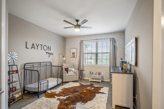 28203 Middlewater View Ln, Katy, TX 77494 - bedroom featuring carpet flooring, a crib, baseboards, and ceiling fan