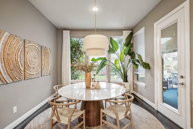 28203 Middlewater View Ln, Katy, TX 77494 - dining area with baseboards and dark wood-style floors