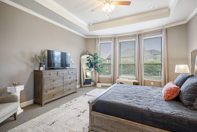 28203 Middlewater View Ln, Katy, TX 77494 - bedroom featuring a tray ceiling, light carpet, ornamental molding, baseboards, and ceiling fan
