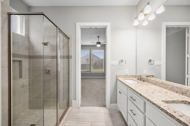13207 Terania Cliff Trce, Houston, TX 77059 - bathroom with a ceiling fan, a shower stall, baseboards, and double vanity