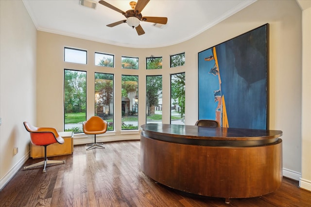 4436 Holt St, Bellaire, TX 77401 - living area featuring plenty of natural light, ornamental molding, wood finished floors, ceiling fan, and baseboards
