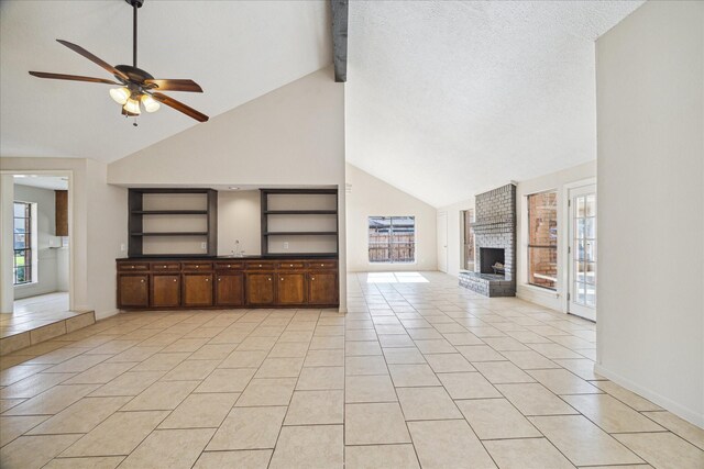 2302 Bright Meadows Dr, Missouri City, TX 77489 - unfurnished living room featuring a ceiling fan, high vaulted ceiling, a brick fireplace, plenty of natural light, and light tile patterned floors