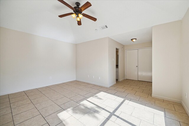 2302 Bright Meadows Dr, Missouri City, TX 77489 - spare room with a ceiling fan, lofted ceiling, light tile patterned floors, and baseboards
