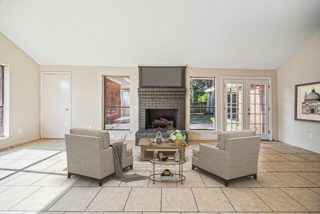 2302 Bright Meadows Dr, Missouri City, TX 77489 - living area with lofted ceiling, a fireplace, and light tile patterned floors