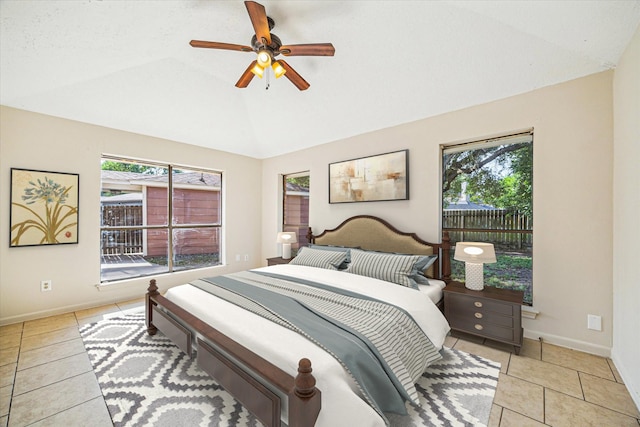 2302 Bright Meadows Dr, Missouri City, TX 77489 - bedroom with vaulted ceiling, light tile patterned flooring, baseboards, and a ceiling fan