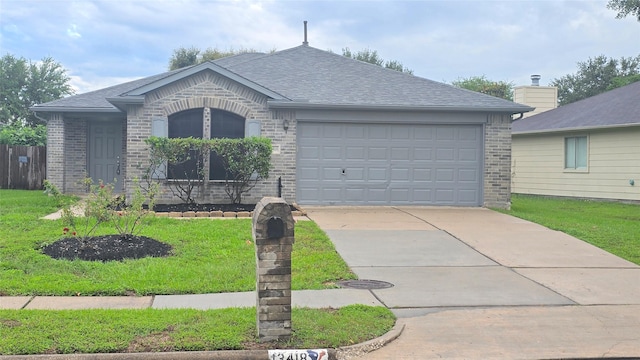 13418 Croquet Ln, Houston, TX 77085 - view of front of home featuring brick siding, roof with shingles, concrete driveway, a garage, and a front lawn