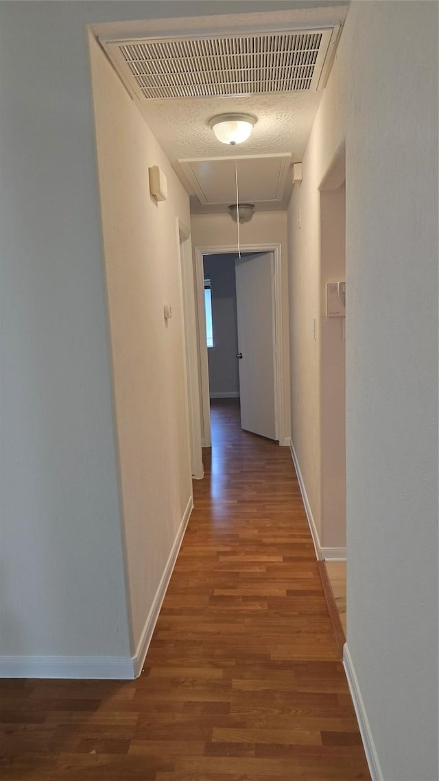 13418 Croquet Ln, Houston, TX 77085 - corridor with attic access, wood finished floors, and baseboards