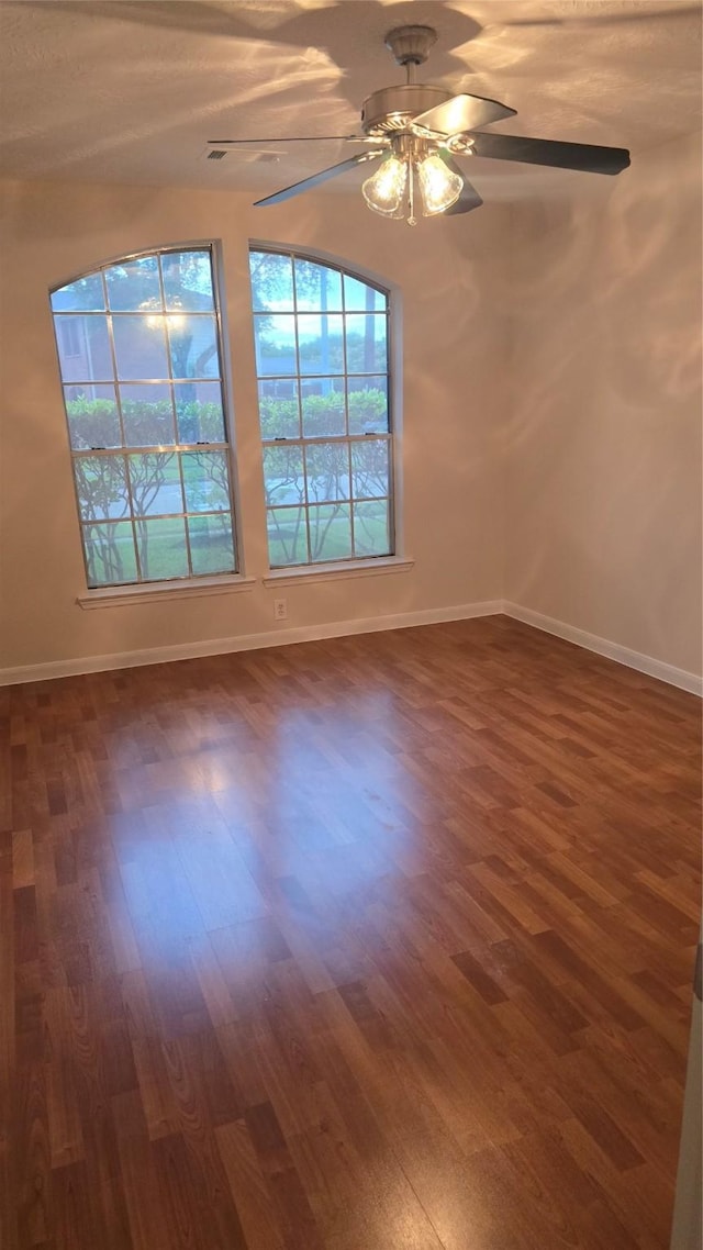 13418 Croquet Ln, Houston, TX 77085 - spare room with dark wood finished floors, ceiling fan, and baseboards