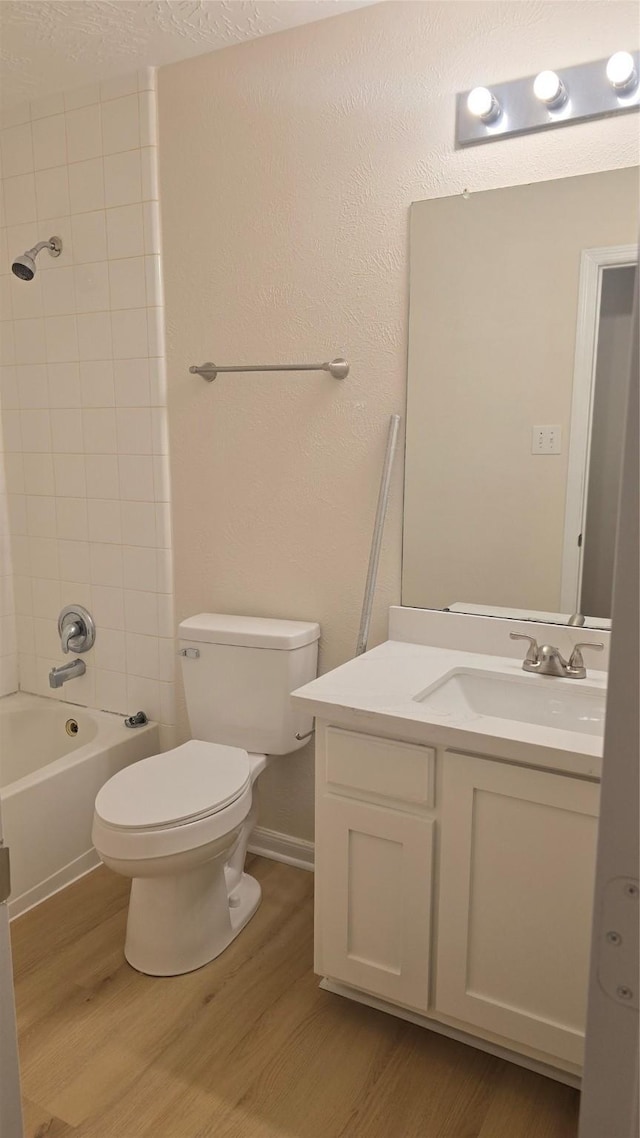 13418 Croquet Ln, Houston, TX 77085 - full bathroom with wood finished floors, toilet, vanity, and bathtub / shower combination
