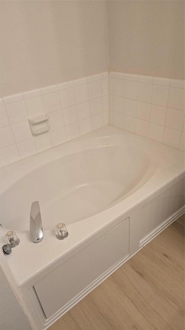 13418 Croquet Ln, Houston, TX 77085 - full bathroom with wood finished floors and a garden tub