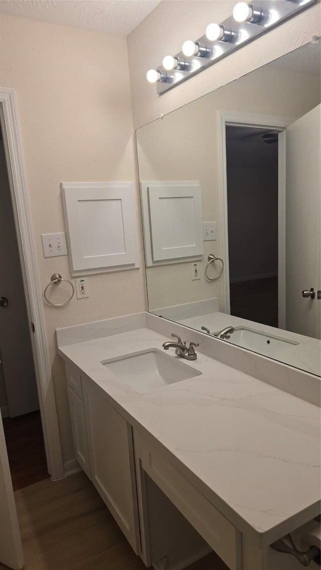 13418 Croquet Ln, Houston, TX 77085 - bathroom with wood finished floors and vanity