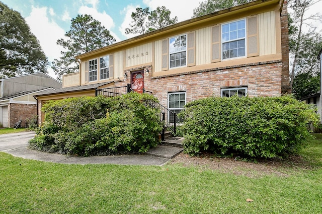 23423 Earlmist Dr, Spring, TX 77373 - split foyer home featuring a front lawn and brick siding