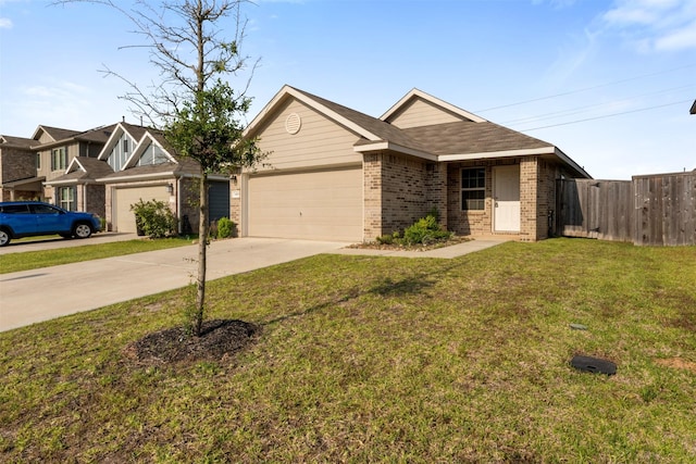 346 Pickwick Gardens Ln, Magnolia, TX 77354 - view of front of house with brick siding, a garage, and concrete driveway