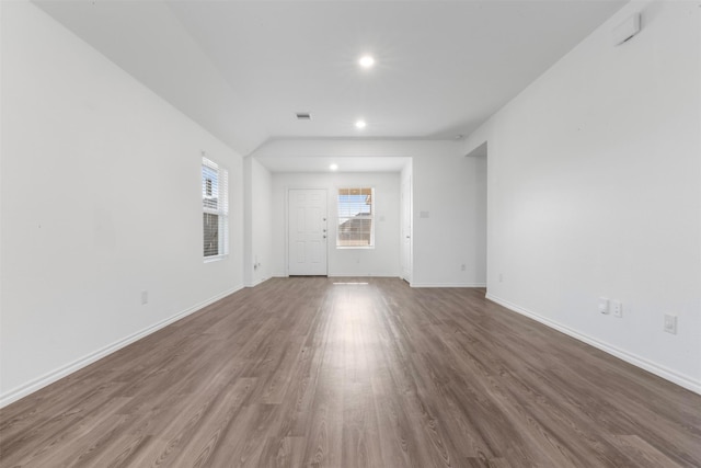 346 Pickwick Gardens Ln, Magnolia, TX 77354 - unfurnished living room with wood finished floors, baseboards, and recessed lighting