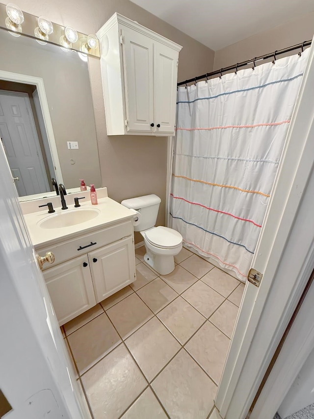 261 Colonial Cir, Athens, TX 75751 - bathroom featuring tile patterned floors, vanity, toilet, and a shower with shower curtain