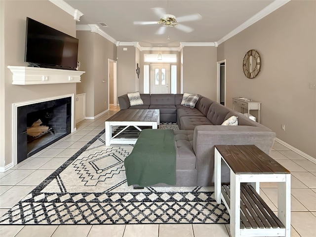 261 Colonial Cir, Athens, TX 75751 - living area with light tile patterned floors, a ceiling fan, crown molding, baseboards, and a fireplace