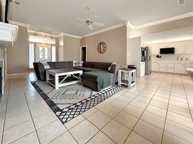261 Colonial Cir, Athens, TX 75751 - living room with light tile patterned floors, crown molding, a ceiling fan, and baseboards