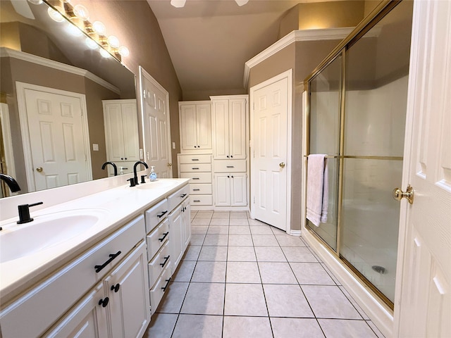 261 Colonial Cir, Athens, TX 75751 - full bath with vaulted ceiling, double vanity, tile patterned flooring, and a stall shower