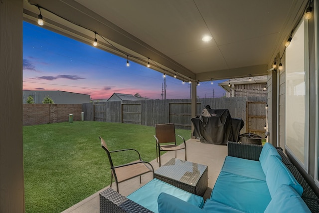 21411 Waldenburg Pl, Tomball, TX 77375 - patio terrace at dusk with an outdoor hangout area, a grill, and a patio