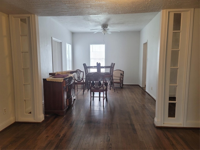 5806 Bayou Bend Ct, Houston, TX 77004 - dining space with dark wood-style floors, ceiling fan, a textured ceiling, and baseboards