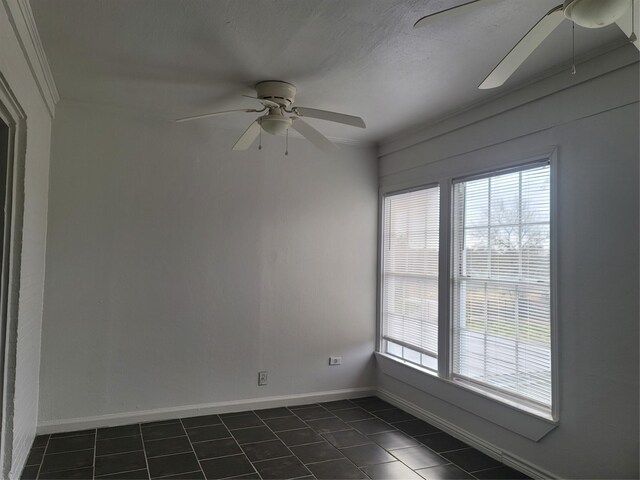 5806 Bayou Bend Ct, Houston, TX 77004 - unfurnished room featuring ceiling fan, dark tile patterned flooring, and healthy amount of natural light