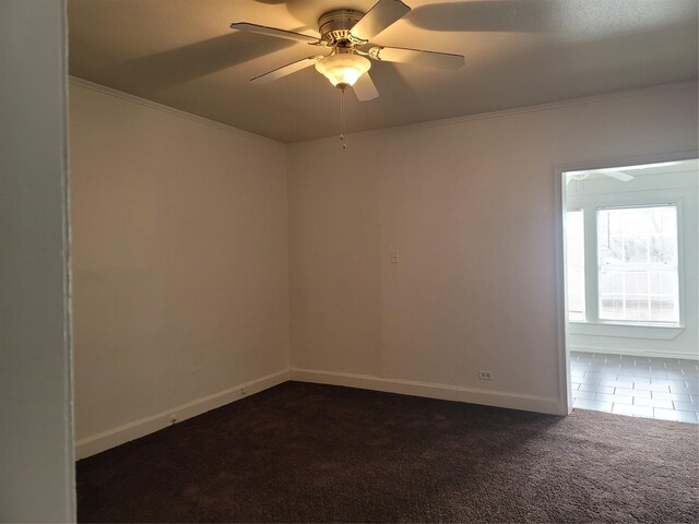 5806 Bayou Bend Ct, Houston, TX 77004 - unfurnished room with dark carpet, ceiling fan, baseboards, crown molding, and dark tile patterned floors
