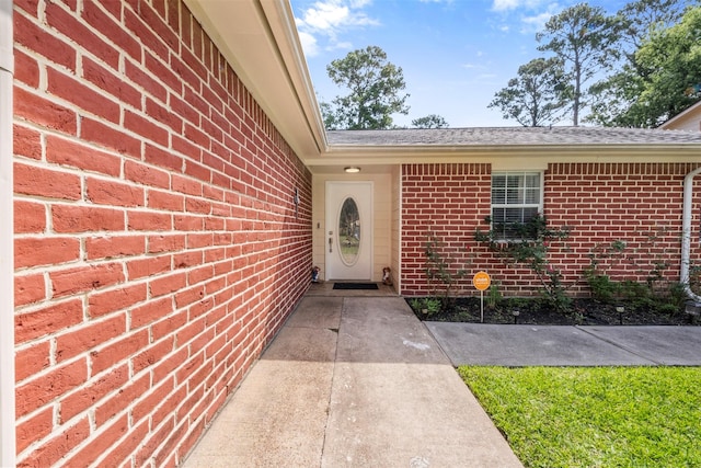 23334 Earlmist Dr, Spring, TX 77373 - view of exterior entry with brick siding and a shingled roof
