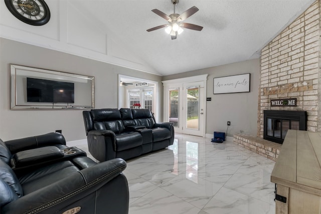 23334 Earlmist Dr, Spring, TX 77373 - living room featuring a ceiling fan, a brick fireplace, light marble finish floors, a textured ceiling, and baseboards