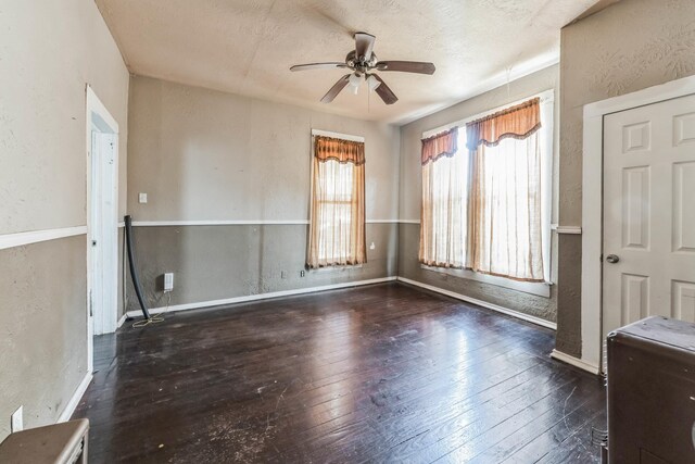 2005 Chestnut St, Houston, TX 77009 - empty room featuring a ceiling fan, hardwood / wood-style floors, a textured wall, and baseboards