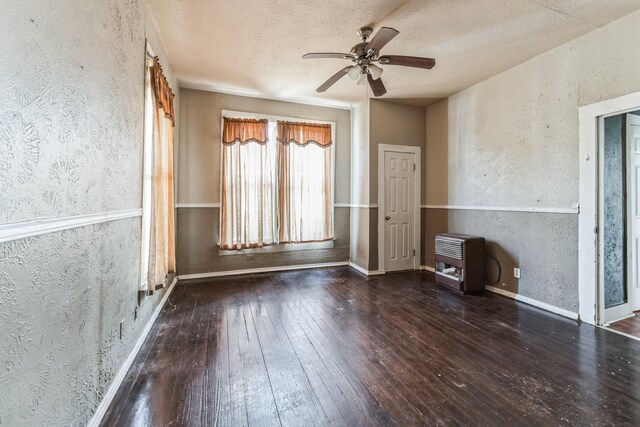 2005 Chestnut St, Houston, TX 77009 - spare room with a textured wall, wood-type flooring, a ceiling fan, a textured ceiling, and baseboards
