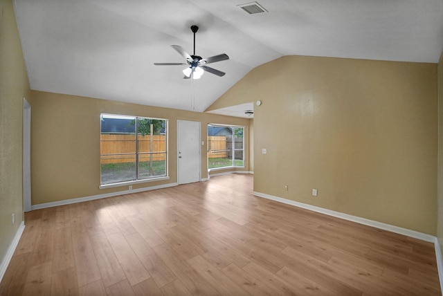 7015 Grackle Dr, Cypress, TX 77433 - unfurnished living room with a ceiling fan, lofted ceiling, baseboards, and light wood finished floors
