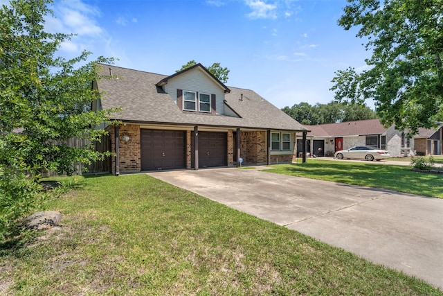19414 Gooselake Ln, Houston, TX 77084 - view of front of house featuring brick siding, driveway, a front lawn, and roof with shingles