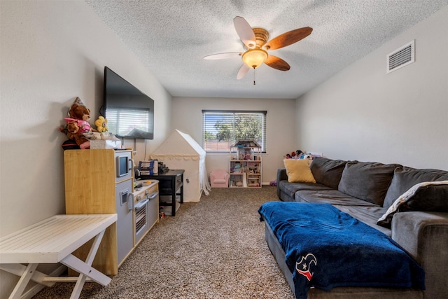 19414 Gooselake Ln, Houston, TX 77084 - carpeted living area featuring a ceiling fan and a textured ceiling