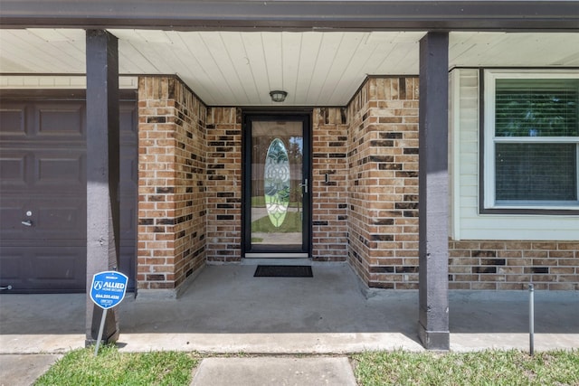 19414 Gooselake Ln, Houston, TX 77084 - entrance to property featuring brick siding, a garage, and a porch