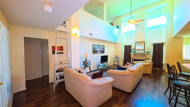 19622 Sasquatch Dr, Tomball, TX 77377 - living area with a ceiling fan, dark wood-type flooring, and a fireplace