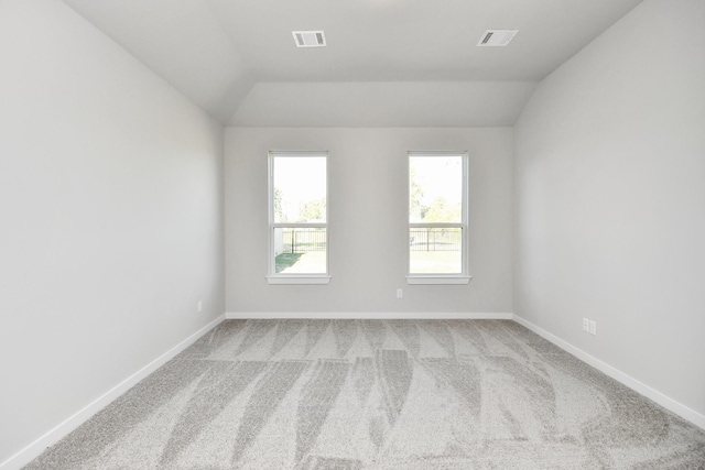 12027 Maple Oak Dr, Houston, TX 77066 - spare room with lofted ceiling, light colored carpet, and baseboards