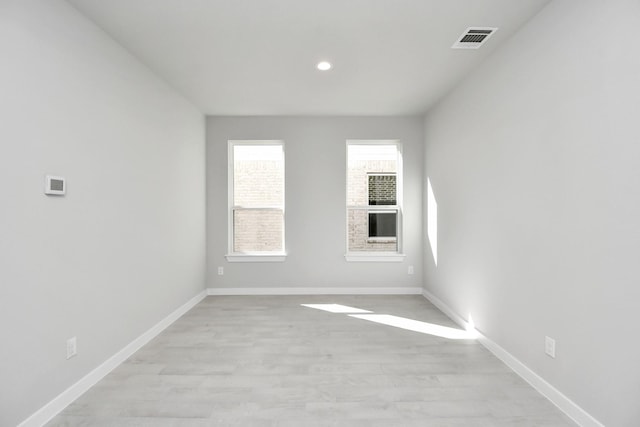 12027 Maple Oak Dr, Houston, TX 77066 - unfurnished room featuring light wood-style flooring, baseboards, and recessed lighting