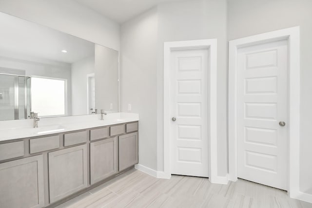 12027 Maple Oak Dr, Houston, TX 77066 - full bath featuring a shower stall, double vanity, baseboards, and recessed lighting