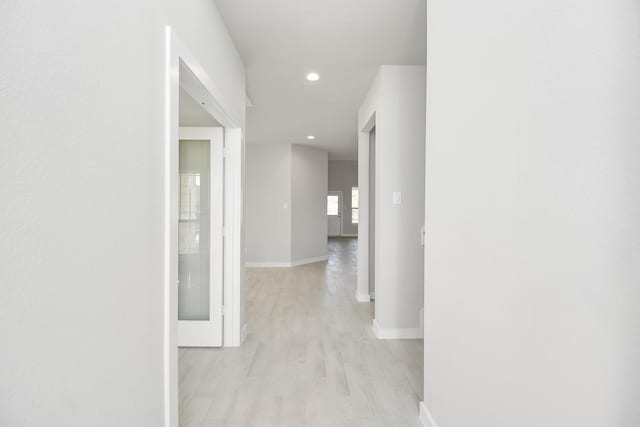 12027 Maple Oak Dr, Houston, TX 77066 - hallway with baseboards, light wood finished floors, and recessed lighting