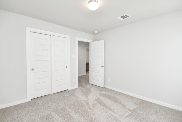 12027 Maple Oak Dr, Houston, TX 77066 - unfurnished bedroom featuring carpet floors, a closet, and baseboards