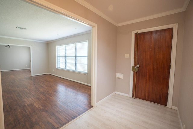 5507 W Bellfort Ave, Houston, TX 77035 - entryway featuring wood finished floors, baseboards, and ornamental molding