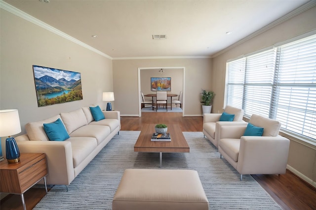 5507 W Bellfort Ave, Houston, TX 77035 - living room featuring wood finished floors, healthy amount of natural light, baseboards, and crown molding